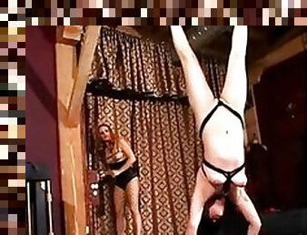 Girl put in a crazy bondage suspension upside down