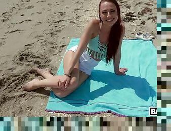 Redhead aidra fox has fun on the beach