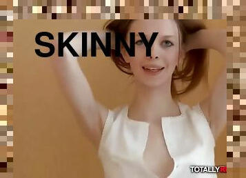 Skinny redhead minx posing nude