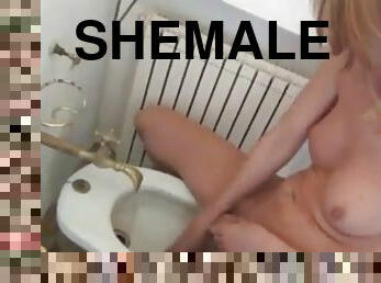 Blond shemale bathing