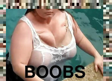 Enormous boobs swimming