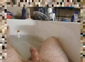 Daddy gives himself a golden shower.  Hot stream of his own piss in tub