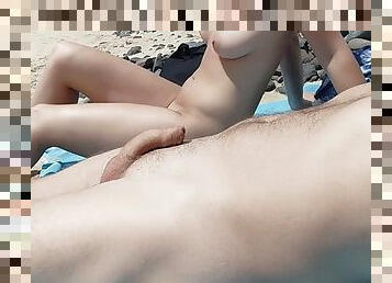 With my stepfather on a nudist beach, when my mother is not there, I touch his cock