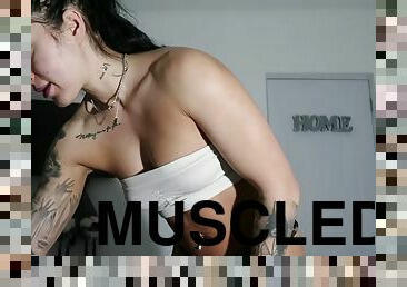 Muscular girl biceps