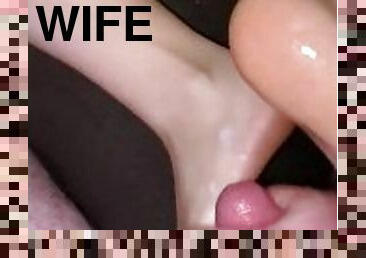 Wife gives footjob on couch and gets cum blasted everywhere!