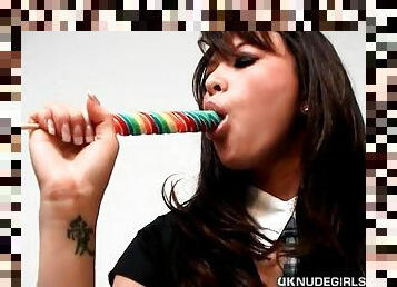 Sexy schoolgirl sucking on her lollipop