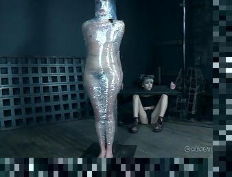 Head to toe plastic wrap binds this kinky girl