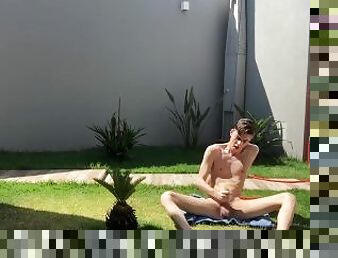 Adorable twink Henry Evans cums while masturbating outdoors