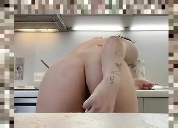 fucks herself in the kitchen
