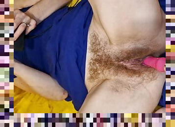He penetrates her hairy pussy with a vibrator and her vagina gets wetter and wetter inside