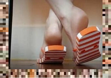 Orange and white striped flip flops