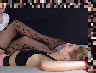 Two Girls Sniffing Each Other Nylon Feet While Tape