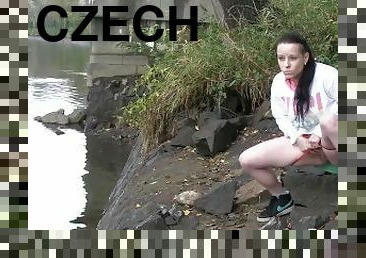 Raven Haired Girl Pees Near The River