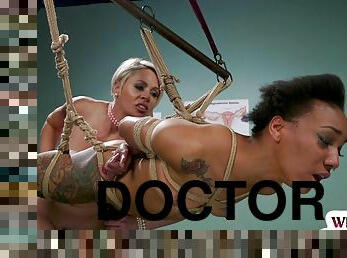 Lezdom doctor toying black patient during kinky check up