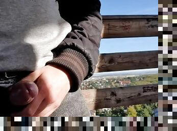 Teen jerking off on a public lookout tower near the city