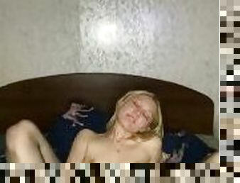 At home alone, student Slovanic Blondie is amusing herself playing with her fingers on the bed leak