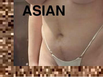 Big tit Asian tries on glitter bikini