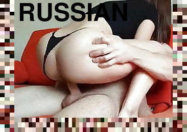 Russian babe rides cock on a couch