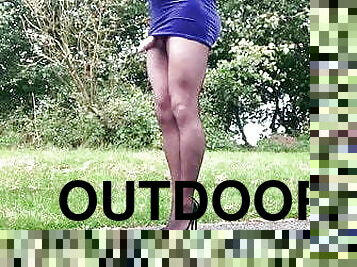 Outdoors in blue velvet dress and pantyhose .