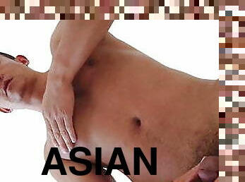 Oriental hunk jerking off and fingering himself 