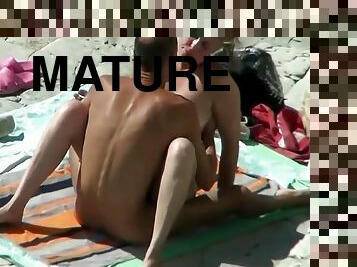 Sex On The Beach. Mature Lovers Fuck In Full View Of Passers By