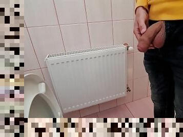 Uncircumcised cock pees on the station toilet