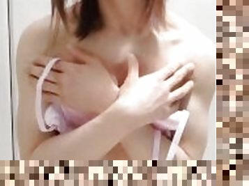 Japanese crossdresser with pink satin lingerie