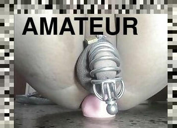 Riding my dildo hard while I am with my chastity belt