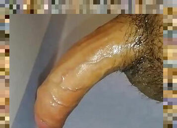 Oily uncircumcised tiny penis gets a quickie jerkoff into a slow motion wall shot cum splurge!