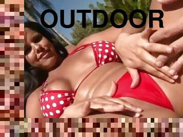 Bikini babe spit roast outdoors