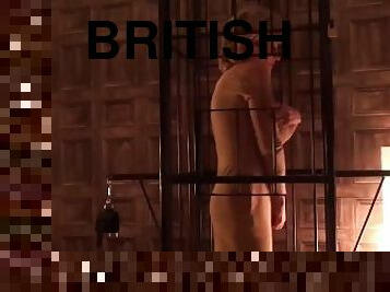 Lady Sonia caged and strips nude in the sex dungeon