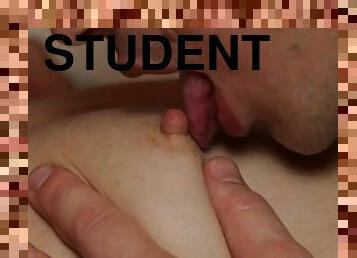 He Passionately Kisses the Beautiful Breasts of the Student. Close-up.
