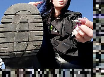 Dirty boot soles for you! Dominatrix Nika is smoking on the beach and you have to lick her dirty boot soles. Boot fetish