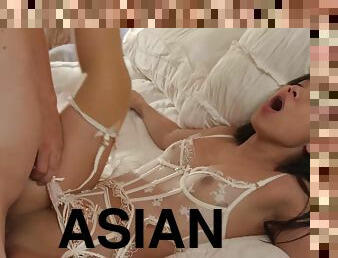 Sweet Asian girl in sexy lace lingerie gets nicely fucked in bed
