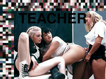 Two kinky schoolgirls fucking their teacher with a strap-on dildo