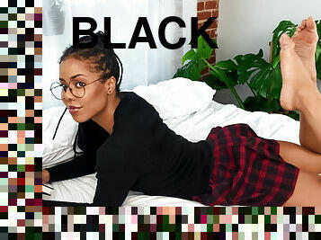 Black college girl Kira Noir plays with her favorite sex toys in bed