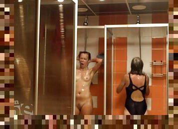 Several naked women in a shower room