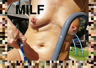 Nippleringlover - Horny milf masturbates outdoors in the pool inserting huge screws into extremely stretched pierced nipples