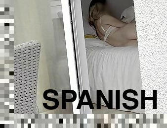 Hot Spaniard was secretly filmed in her hotel room through the window as she took nude pictures