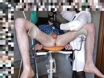 Nurse gives a 2 liter enema to a patient in a gynecological chair