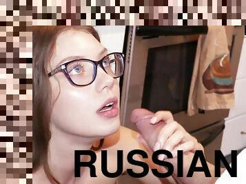 Russian beauty with glasses screwed in the living room