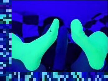 Domme with Strap-on puts on Neon Socks Under Black Light - Socks and Feet - Video 9