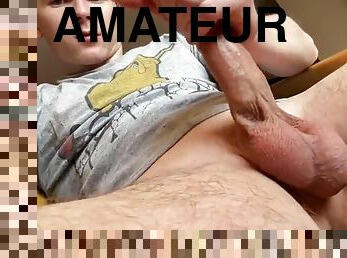 Teen boy jerks off a beautiful cock and cums hard on a T-shirt. Moans, jerks off.