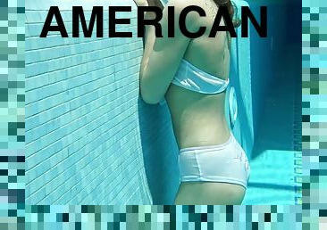 Hot American blonde Lindsay Cruz swims naked in the pool