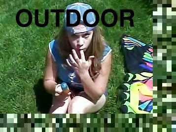 Cute Little April Outdoors Sucking A Popsicle