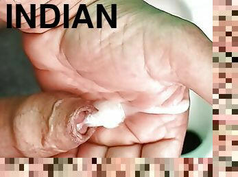 Indian middle age man massage his pennis with oil and gel