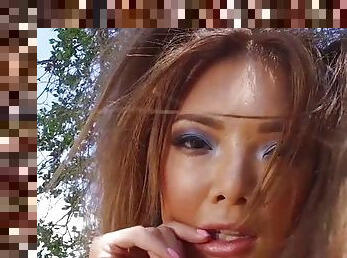 Thai chick takes a long masturbation session in the woods