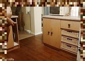Sexy guy pissing all over the kitchen floor and making a big puddle