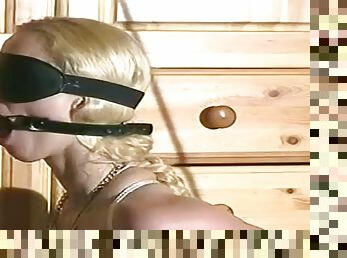Sweet slender blonde with mask on her face