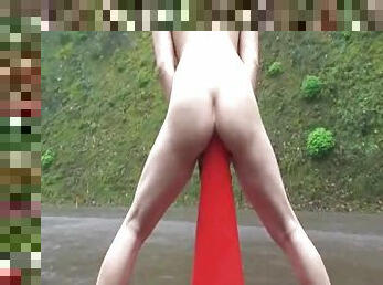 Crazy slut fucks a road cone in a public street